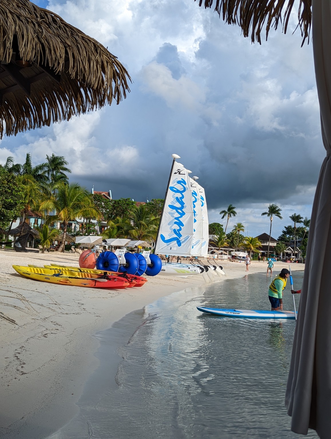 Sandals catamarans lined up on a Caribbean beach