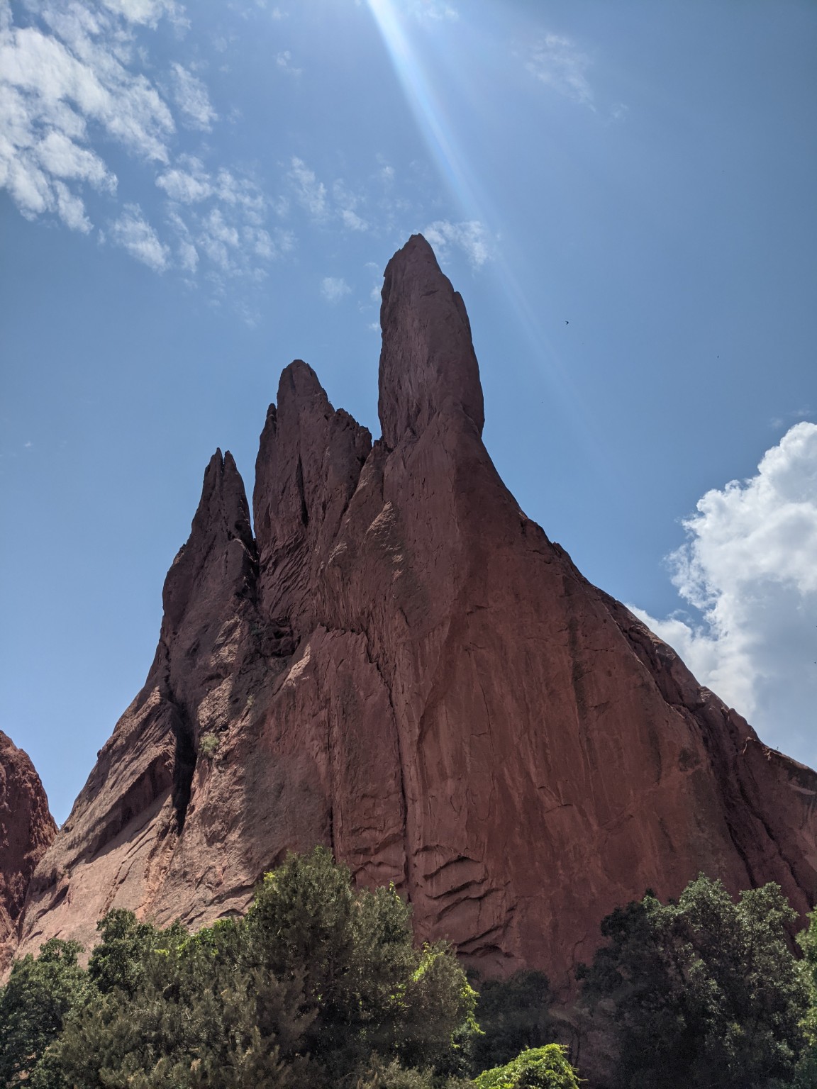 Dramatic red rock formations against a bright blue sky