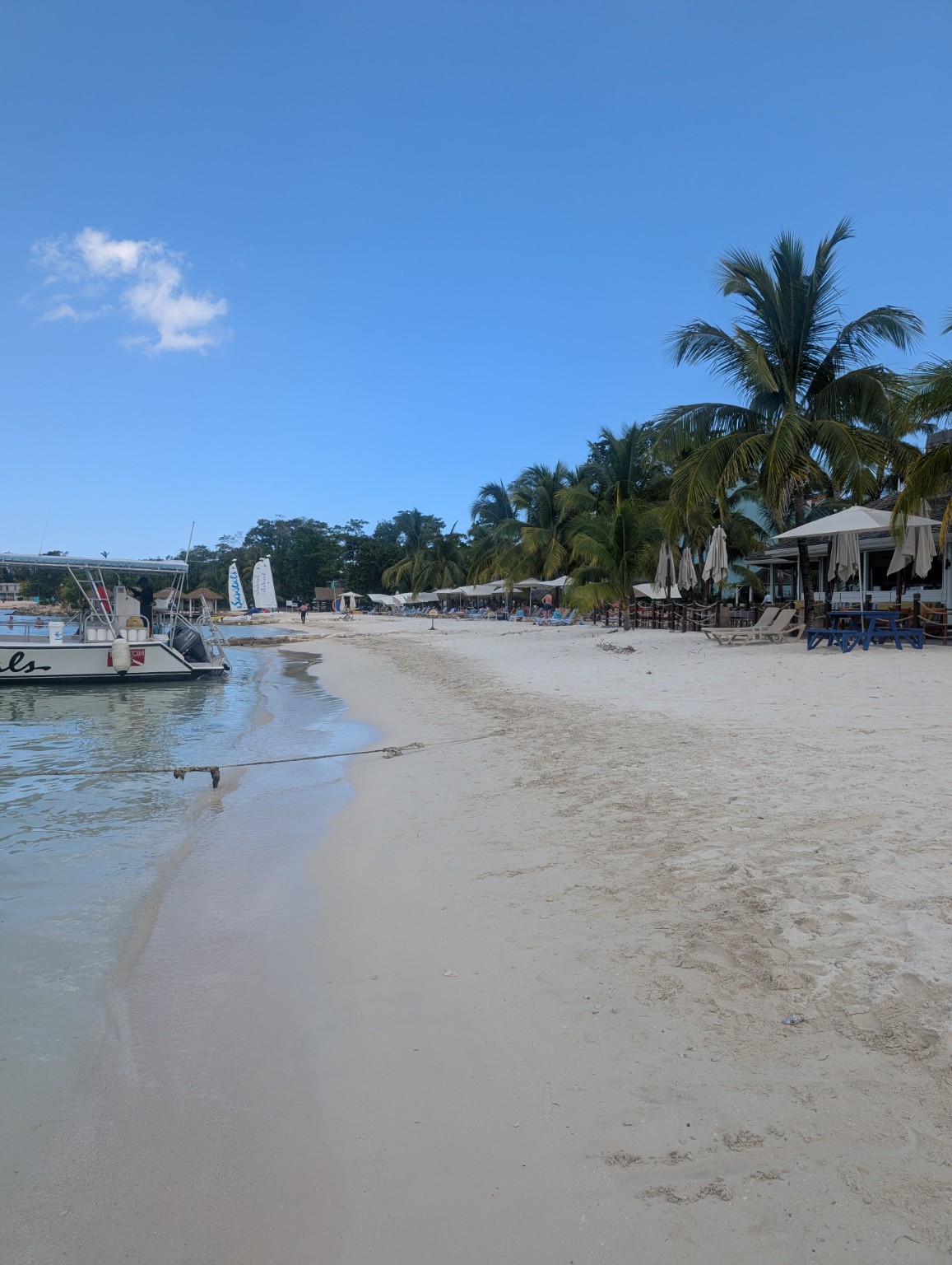 Blue Caribbean water viewed from a tropical resort